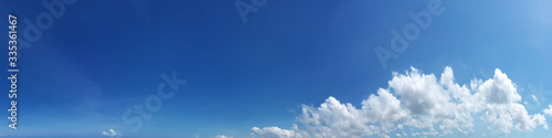 Panoramic fluffy cloud in the blue sky. Sky with cloud on a sunny day.