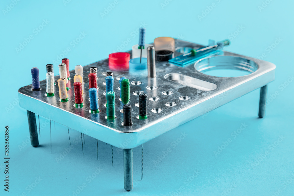 Set of dental needles for root canal treatment process on a metal stand