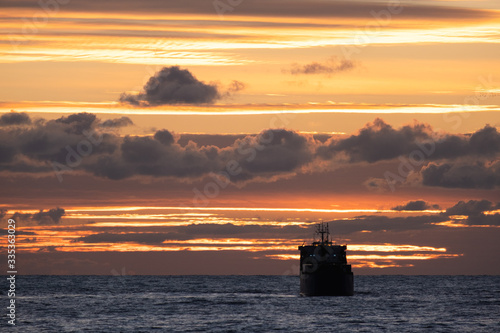 cargo ship at sunset. Black sea