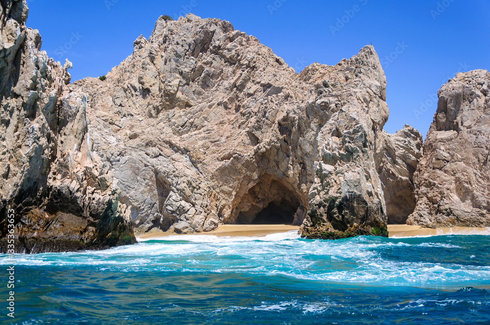 Cave inside rock formation on a beach without people in Cabo San Lucas, Mexico