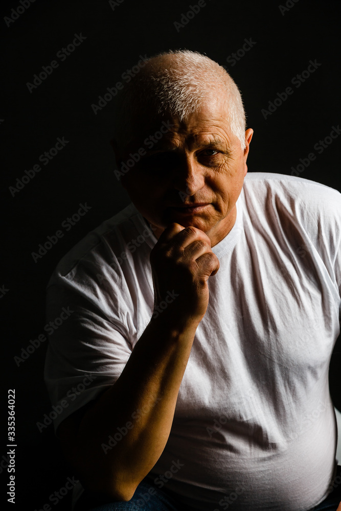 Old senior man closeup serious expression portrait