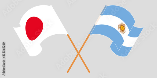 Crossed and waving flags of Argentina and Japan