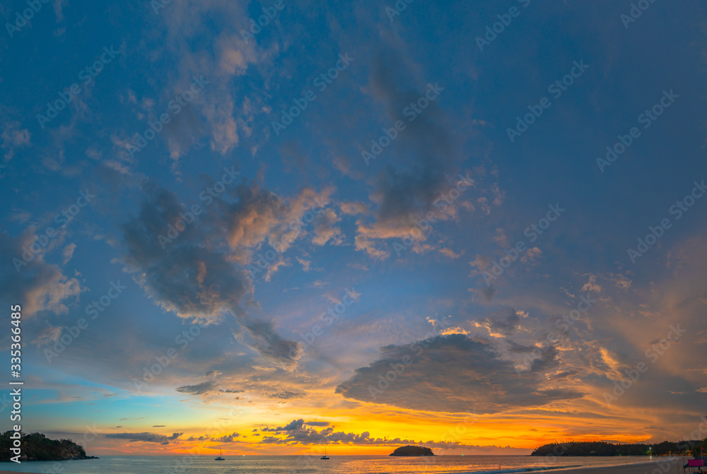 .beautiful cloud in golden sky at sunset in Kata beach Phuket Thailand.