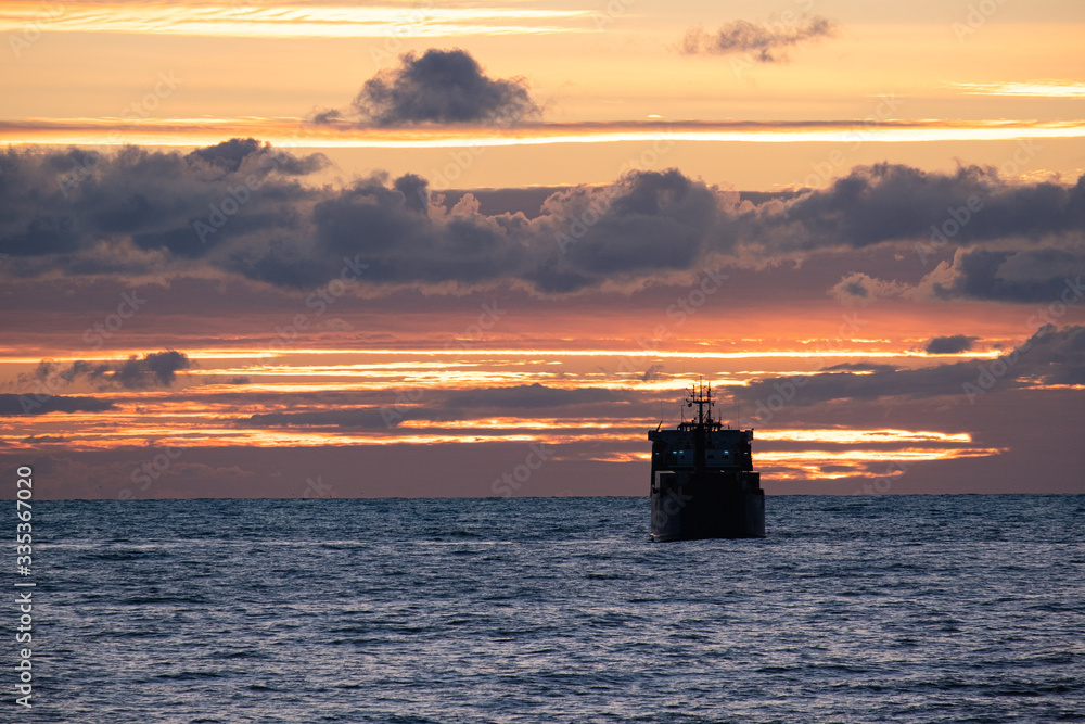 cargo ship at sunset. Black sea
