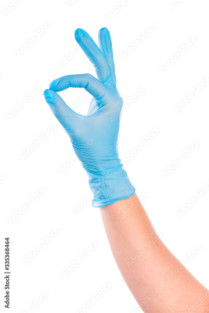 female hand in sterile gloves isolated on white background showing .hand gestures- Image female hand in sterile gloves isolated on white background showing .hand gestures- Image
