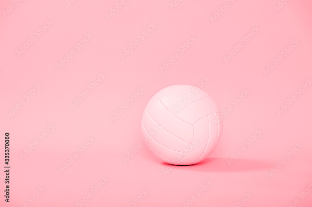 Volleyball ball isolated on pink background.