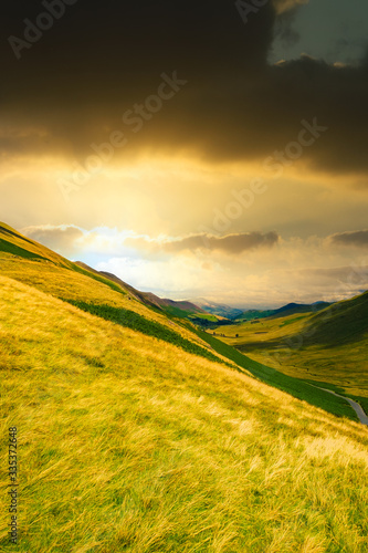 Sunset at a valley among the mountains of the Lake District in England