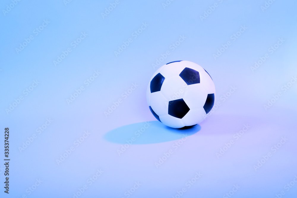 Fototapeta premium Soccer ball isolated on blue background