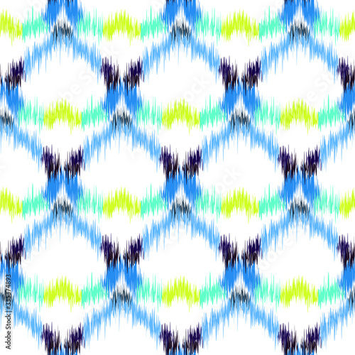 Ikat seamless colorful geometric pattern. Abstract background texture. 