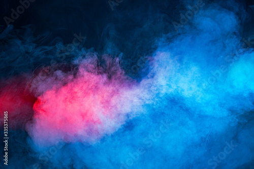 Background from texture of mixing red and blue smoke, abstraction.