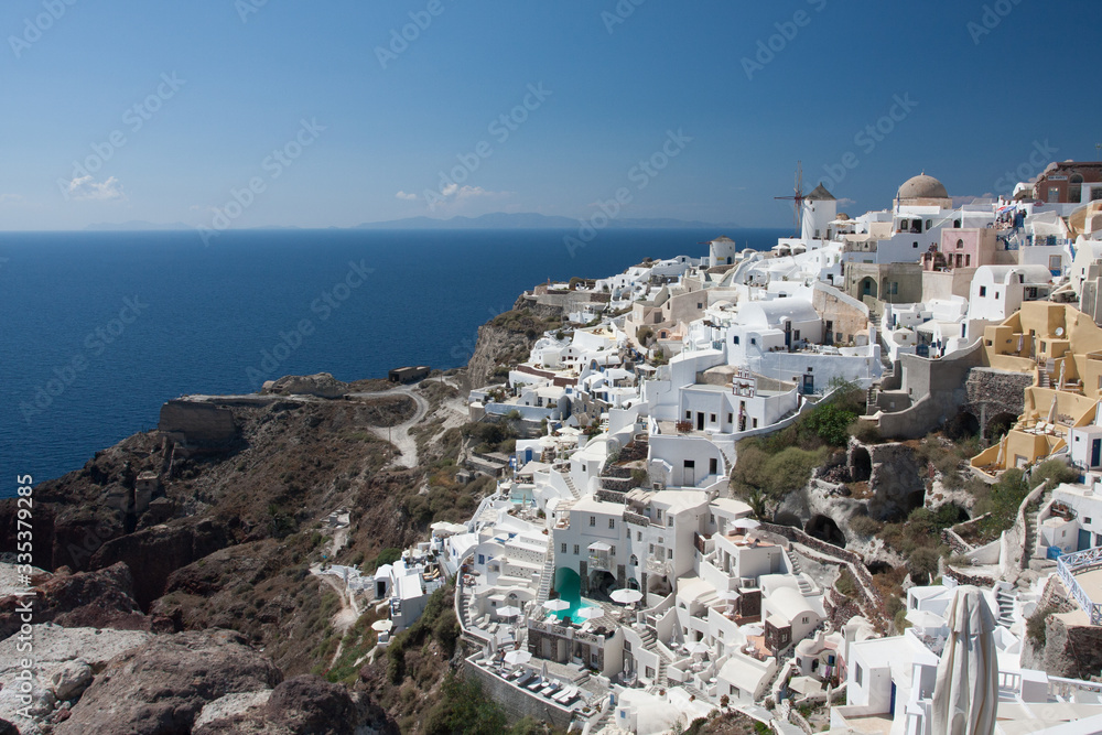 Santorini island, Greece, Aegan Sea. Traditional and famous white houses and churches with sea view