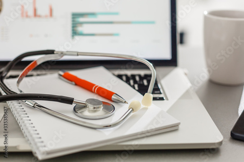 Doctor preparing online internet prescription selective focus