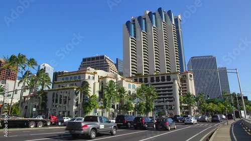 Busy traffic along Nimitz Highway in downtown Honolulu on Oahu breezes by the high-rise modern buildings in this business district along the Honolulu Harbor