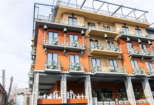 Hotel brim building exterior and architecture.  New district with white car standing outside. Tbilisi.Georgia.06.03.2020. photo