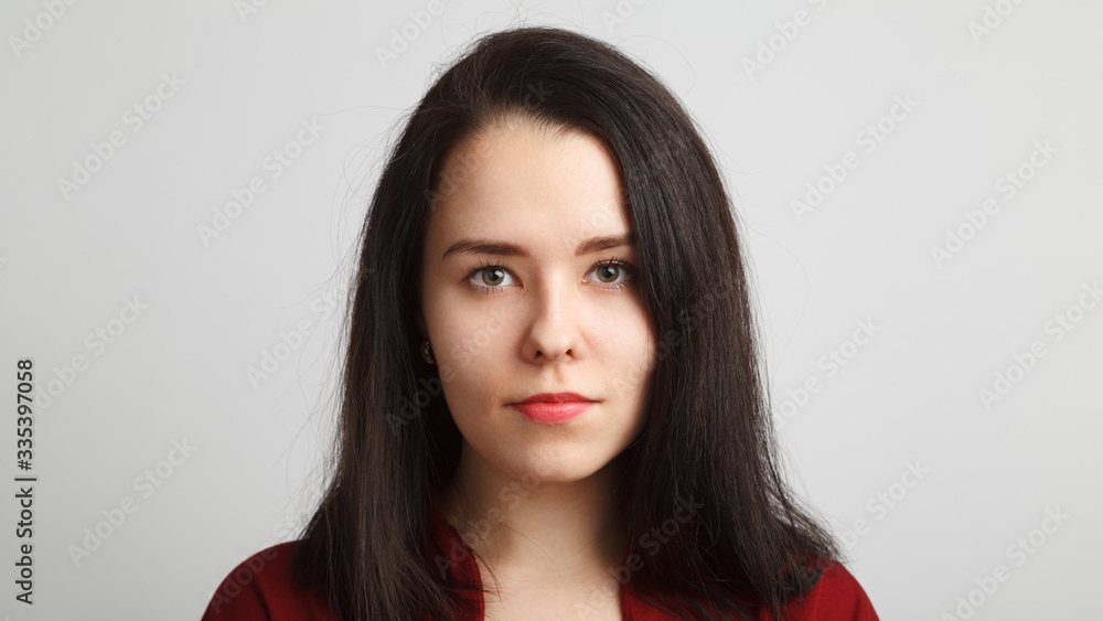 Head and shoulreds woman headshot in red over white background Head and shoulreds woman headshot in red over white background