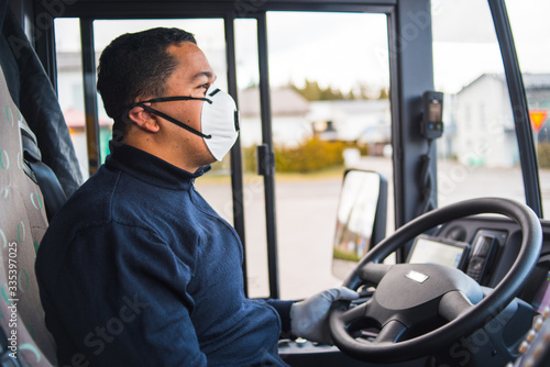 busdriver with protection mask and gloves driving intercity bus. Pandemic coronavirus 2020. Quarantine.Virus concept. Epidemic infection.