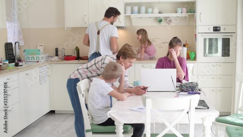 Busy, hectic everyday family life at home with multiple kids of different age