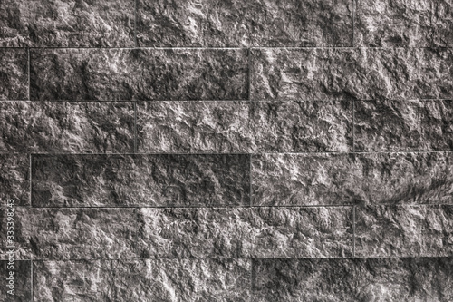 Black and white stone wall texture, abstract decorative brick blocks, monochrome tile with a pattern, grunge background