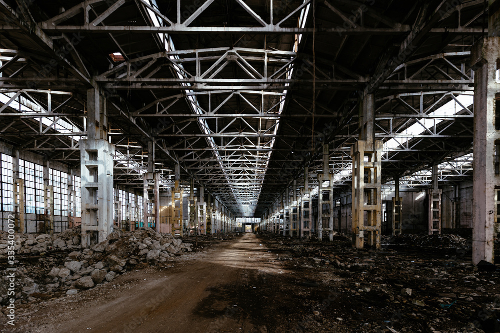 Abandoned large industrial hall waiting for demolition. Former Voronezh excavator manufacturing factory Abandoned large industrial hall waiting for demolition. Former Voronezh excavator manufacturing factory