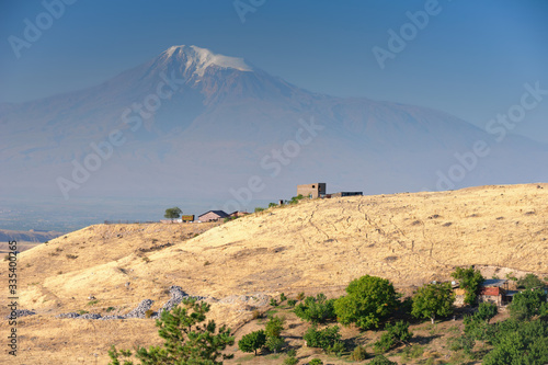 Mount Ararat, view from Armenia. Small armenian village with the snowy summit of the mountain on the background.