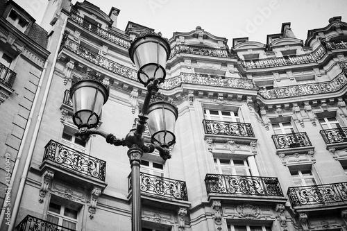 Photography Parisian building with lamp in front Haussmann architecture low angle, France Eu