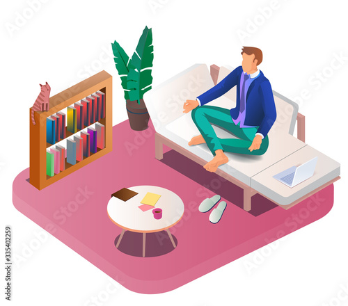 Concept of a coronavirus outbreak. A young man is sitting in a meditation position at home on the sofa. The Earth-19 virus is in the air. Staying at home with an independent quarantine. Work from home