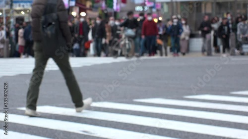 Wallpaper Mural TOKYO, JAPAN -FEB 2020 : Crowd of people at Shibuya Scramble Crossing in busy weekend. Many pedestrians (Japanese people and tourist) at the street. Focus in front. Modern city lifestyle concept shot. Torontodigital.ca