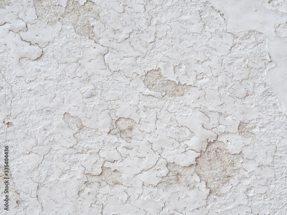 Ditry white old painted wall peeling off cause by low quality paint that has inadequate adhesion and flexibility,Over thinning the paint or spreading it too thin. Poor adhesion of the underlying coats