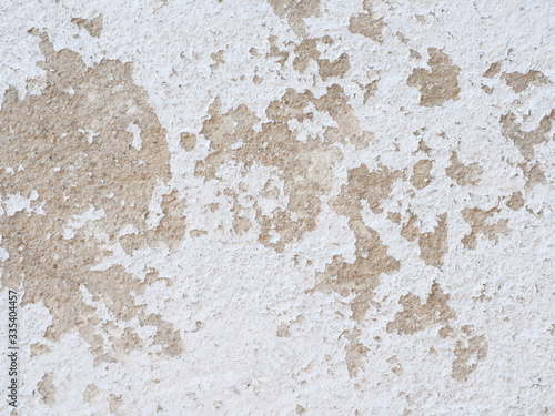 Ditry white old painted wall peeling off cause by low quality paint that has inadequate adhesion and flexibility,Over thinning the paint or spreading it too thin. Poor adhesion of the underlying coats