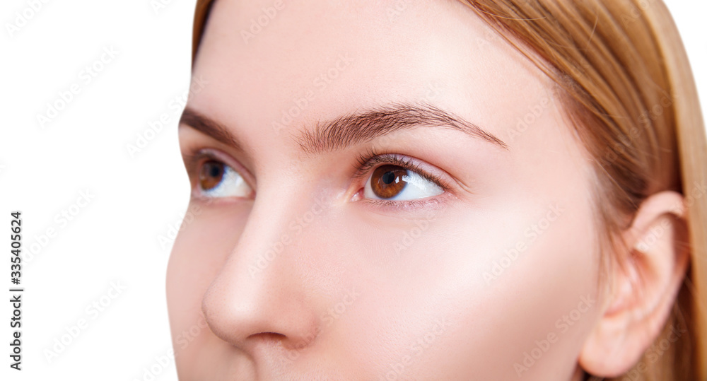 Close-up shot of young woman looks up. Over white background Close-up shot of young woman looks up. Over white background