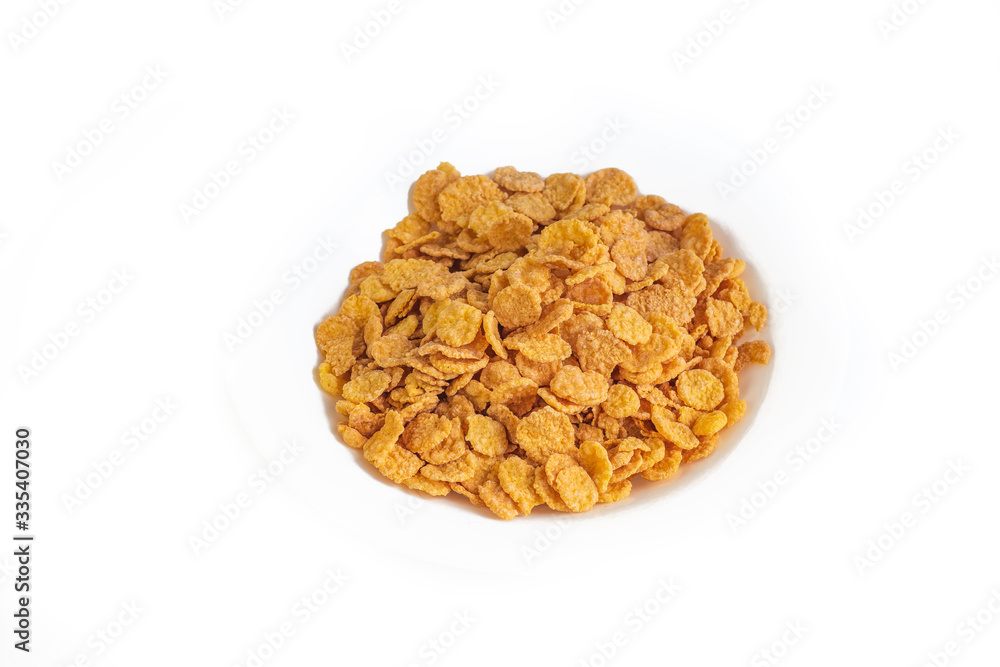Flakes. Plate on a white background. Close-up. Is isolated Flakes. Plate on a white background. Close-up. Is isolated