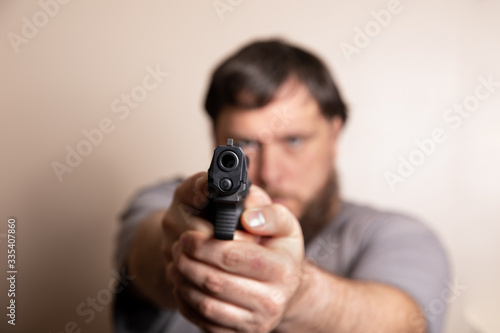 looking down the barrel of a pistol