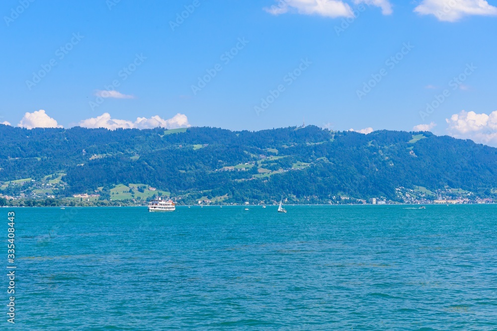 View on Bodensee lake Constance, from harbor in Lindau island, alps mountains. Baden-Wurttemberg  Germany.