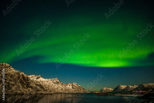 Dramatic polar lights  Aurora borealis over the mountains in the North of Europe - Lofoten islands  Norway