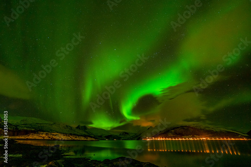 Dramatic polar lights, Aurora borealis over the mountains in the North of Europe - Lofoten islands, Norway