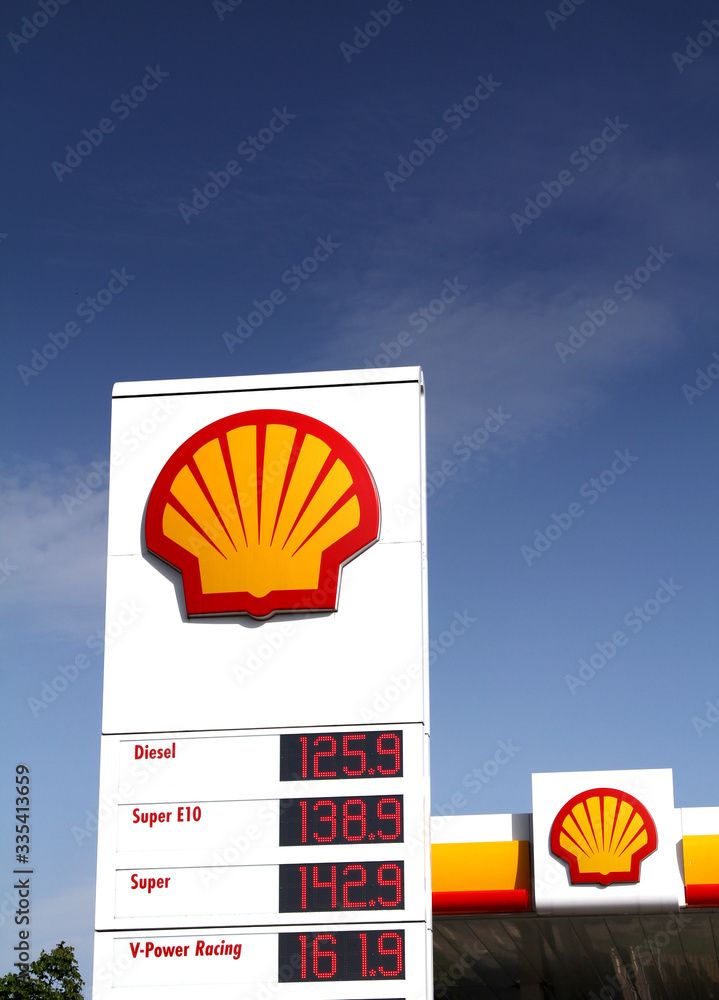 Nurnberg, Germany : Shell sign against blue sky. Shell is an Anglo-Dutch  multinational oil and gas company headquartered in the Netherlands and  incorporated in the United Kingdom. Stock Photo | Adobe Stock