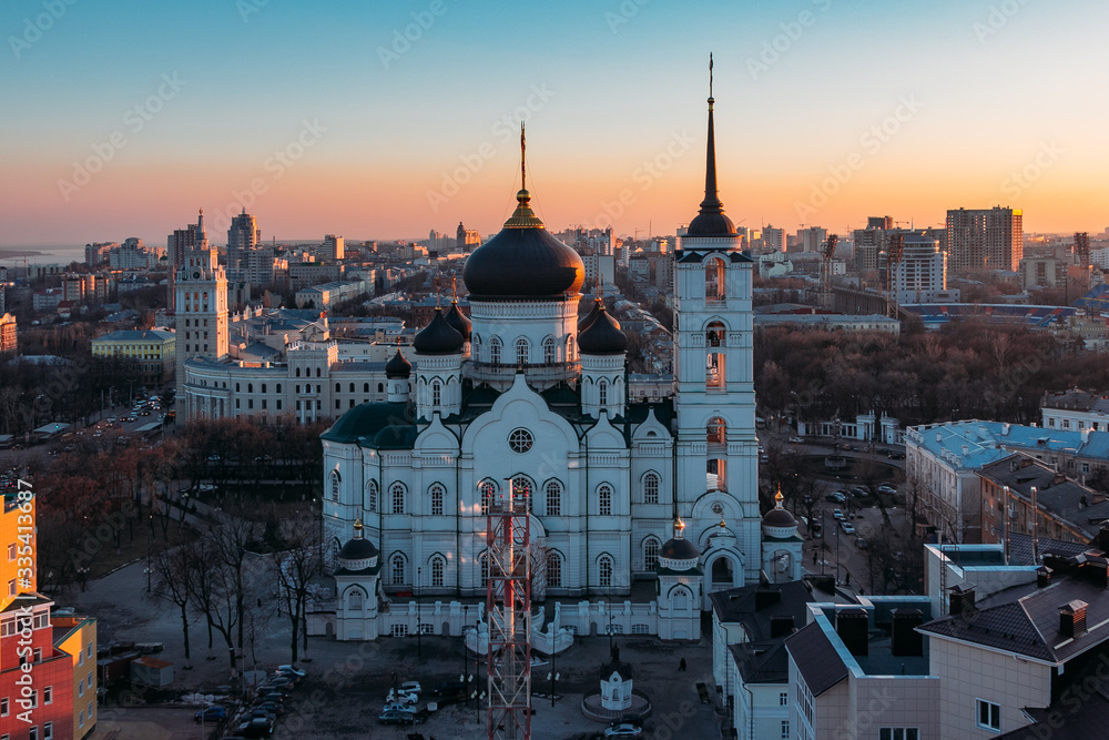 Evening Voronezh cityscape. Tower of management of south-east railway and Annunciation Cathedral at sunset background
