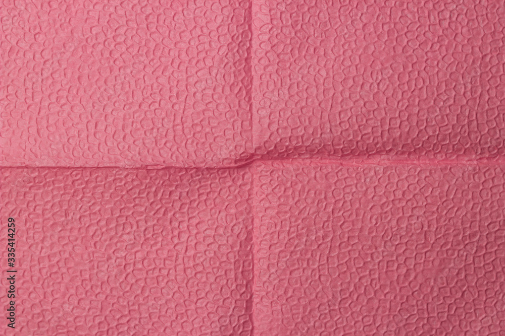 Fototapeta premium Background of an pink napkin in the form of an open book