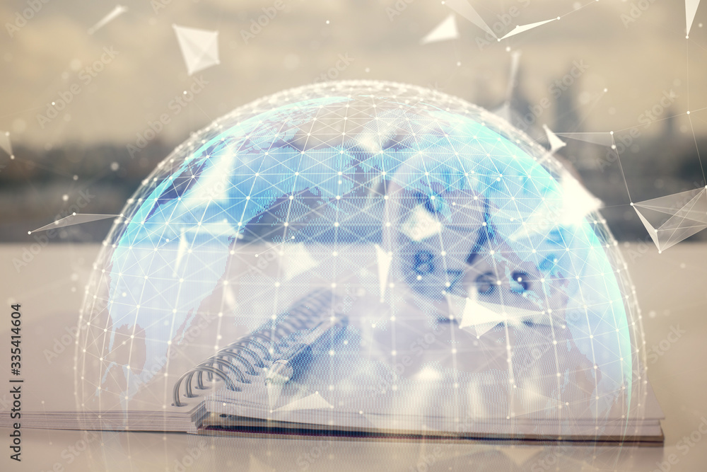 Double exposure of business theme drawings and desk with open notebook background. Concept of international market Double exposure of business theme drawings and desk with open notebook background. Concept of international market
