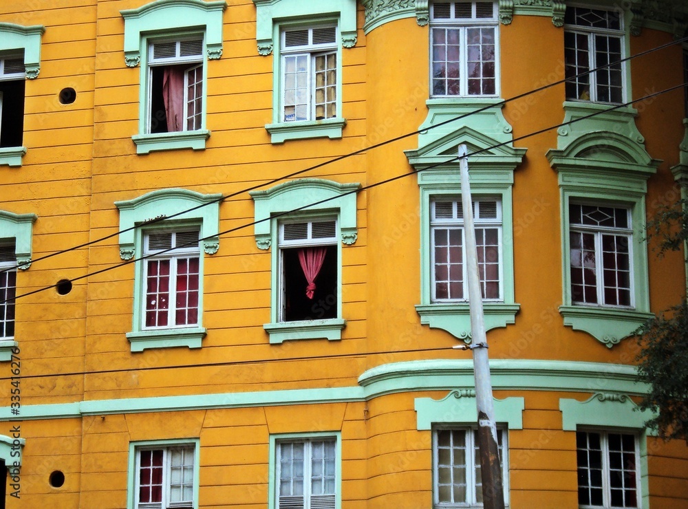 Green windows and the yellow background in the center of the city, Sé square.