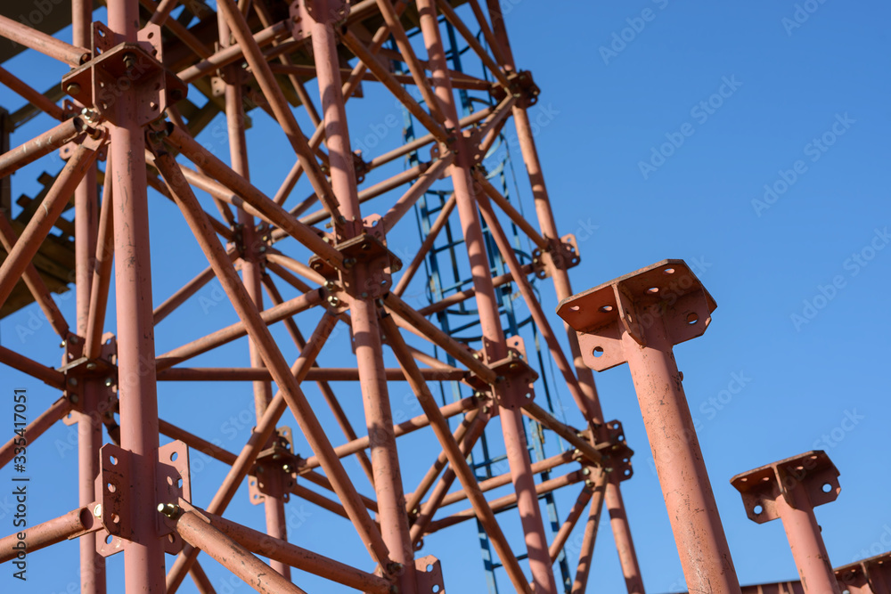 Scaffolding Elements Construction. Metal scaffolding tubes and bars. Construction site details. Bridge support. Industrial background. Scaffolding Elements Construction. Metal scaffolding tubes and bars. Construction site details. Bridge support. Industrial background.