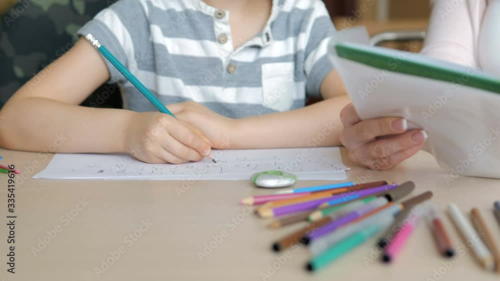 Home schooling. Boy doing his homework at home during the quarantine Home schooling. Boy doing his homework at home during the quarantine