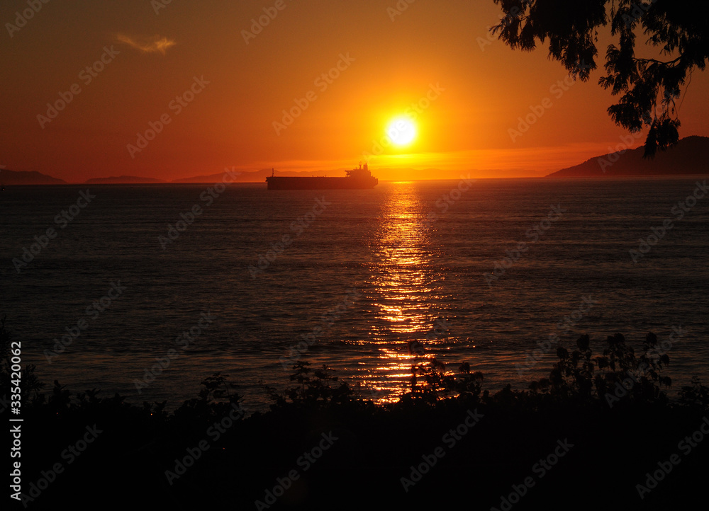 Ship Meets Enchanting Sunset At Stanley Park In Vancouver