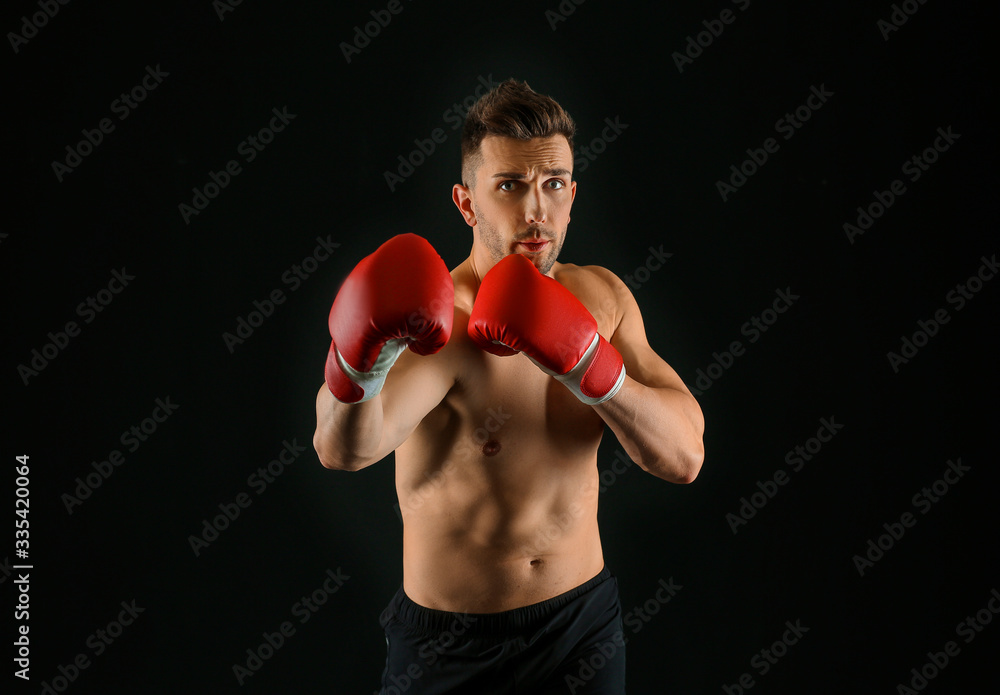 Handsome young boxer on dark background Handsome young boxer on dark background