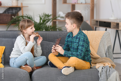 Happy young children eating...