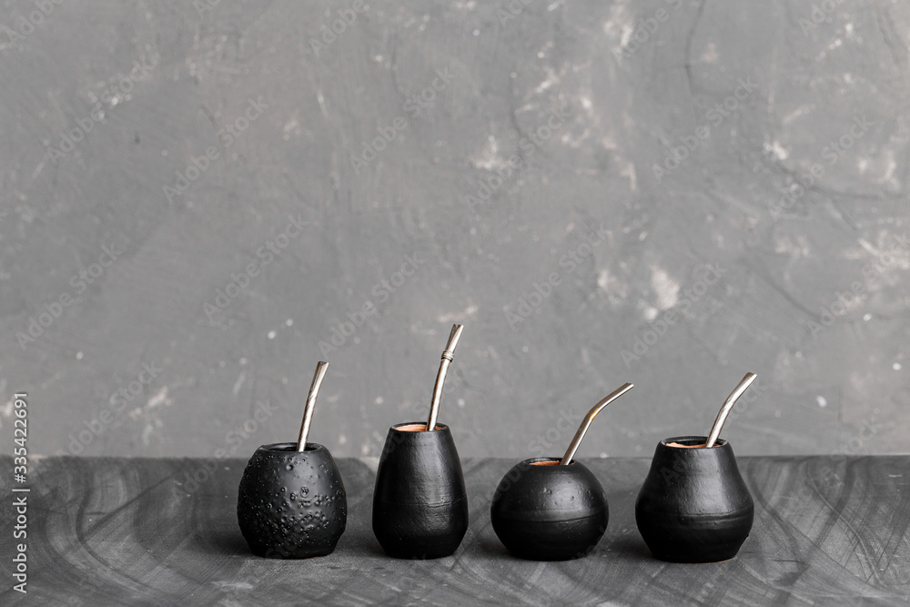 Black gourd with sipped metal straw best use for Yerba Mate tea.