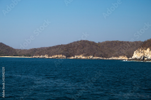 Huatulco bay with blue ocean