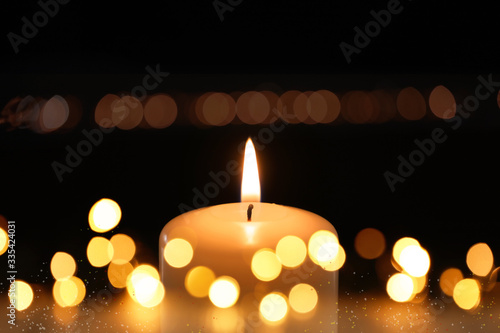 Wallpaper Mural Burning candle on dark background, bokeh effect Torontodigital.ca