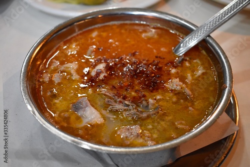 Close up photo of Lamb soup served with spices