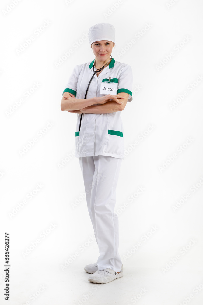 Doctor in a white robe with a stethoscope in his hands. Doctor in a white robe with a stethoscope in his hands.